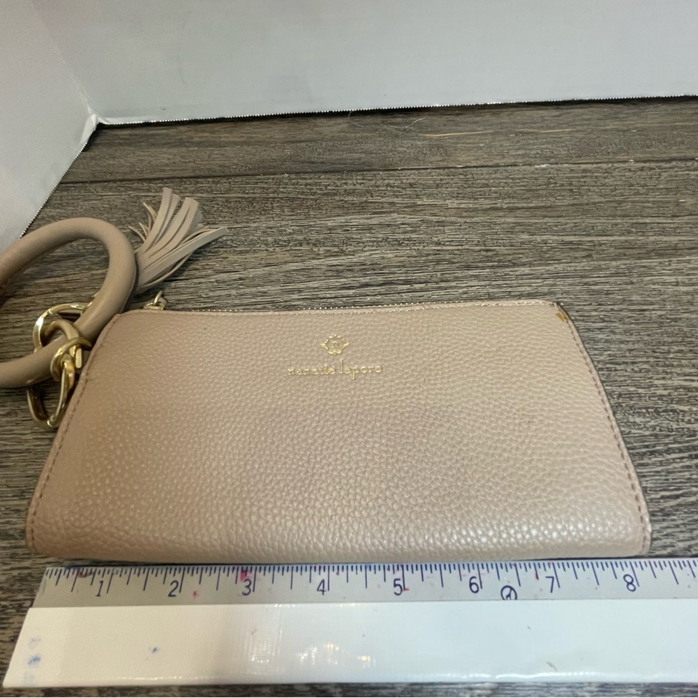 Nanette lepore Tan Clutch with Tassel Accent wristlet. Small flaw on corner - Picture 8 of 9